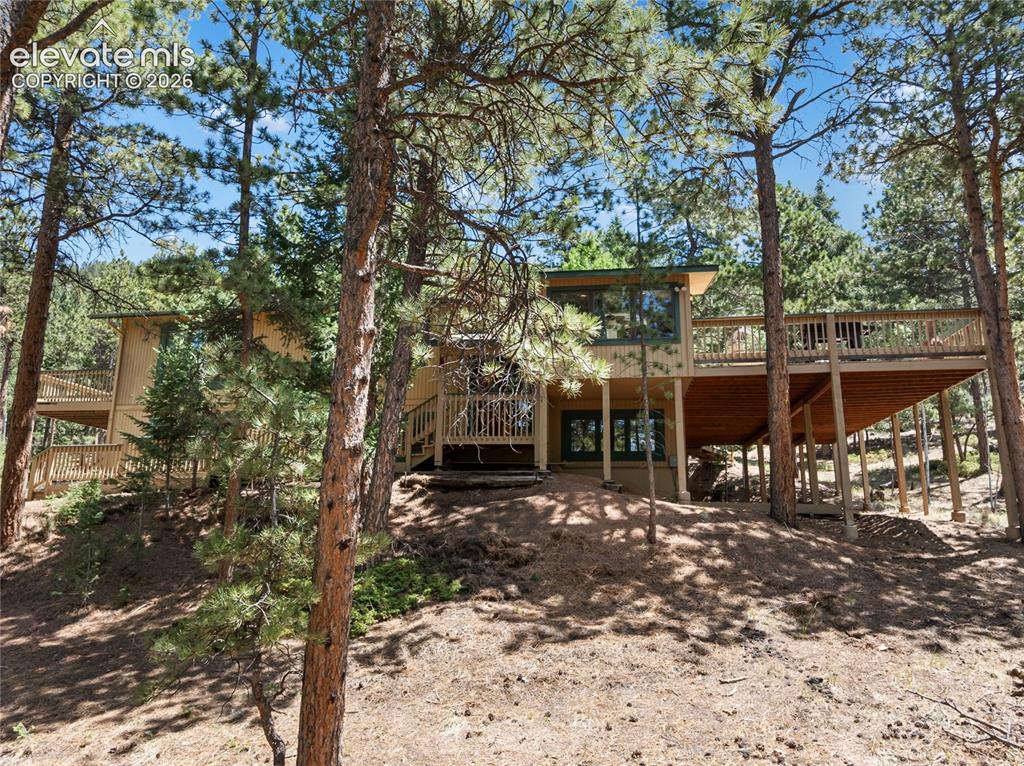Image 3 of 38: And, its just fine to step out onto the massive back deck to simply relax!