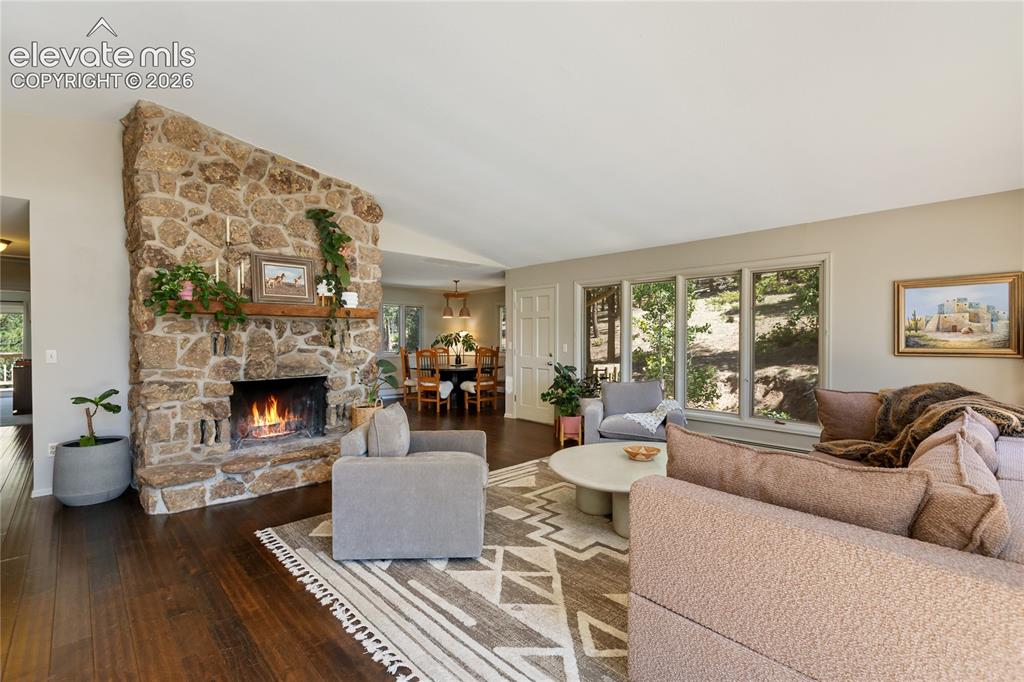 Image 7 of 38: I love this hand placed, floor to ceiling stone, wood burning fireplace!