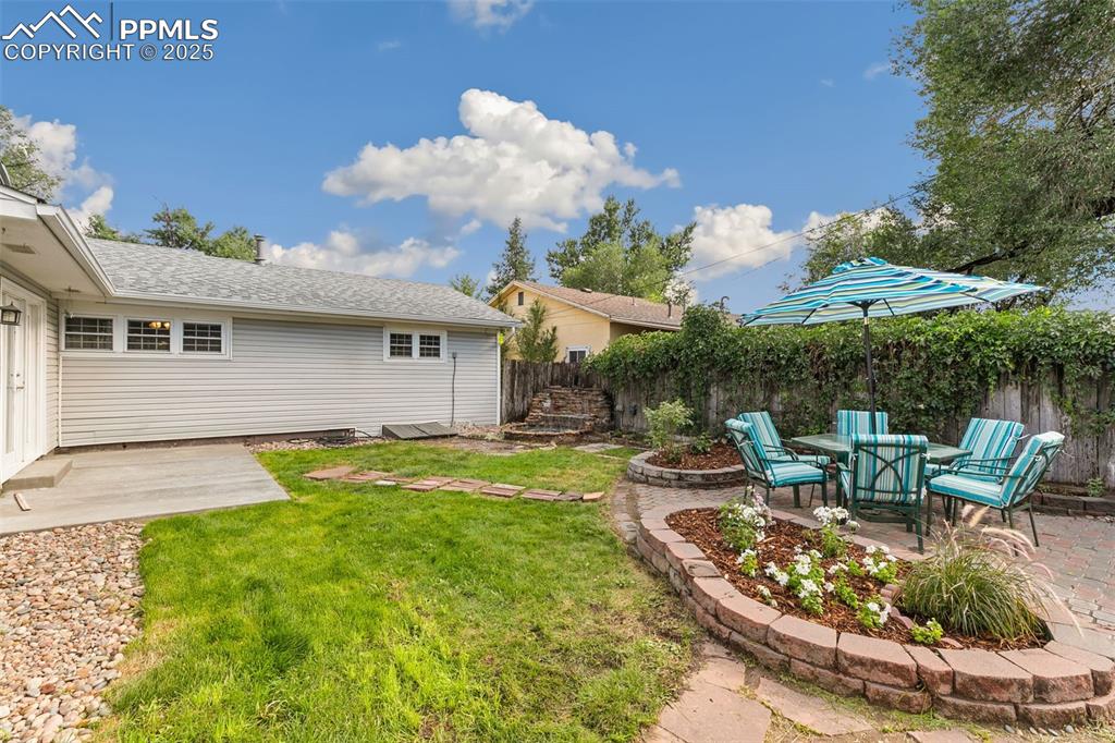 Image 17 of 17: Fenced backyard featuring a patio