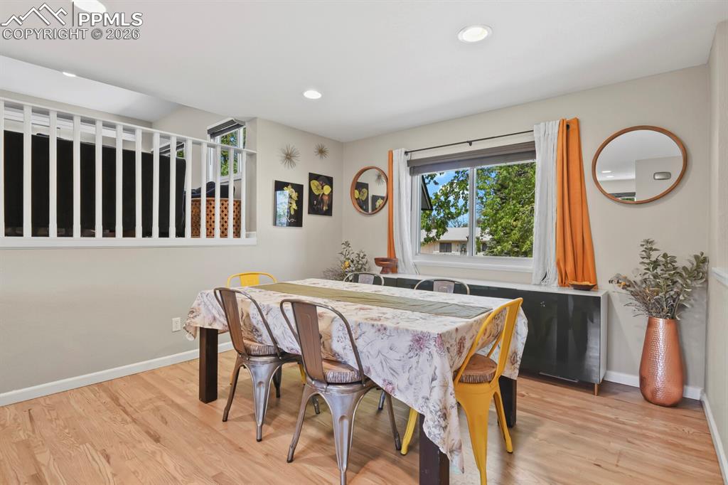 Image 10 of 38: This dining area features hardwood floors, recessed lighting and a nice siz