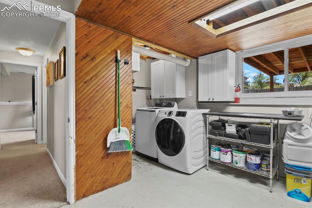 Image 32 of 38: The laundry room is paired with the furnace room on the lower level. Featur