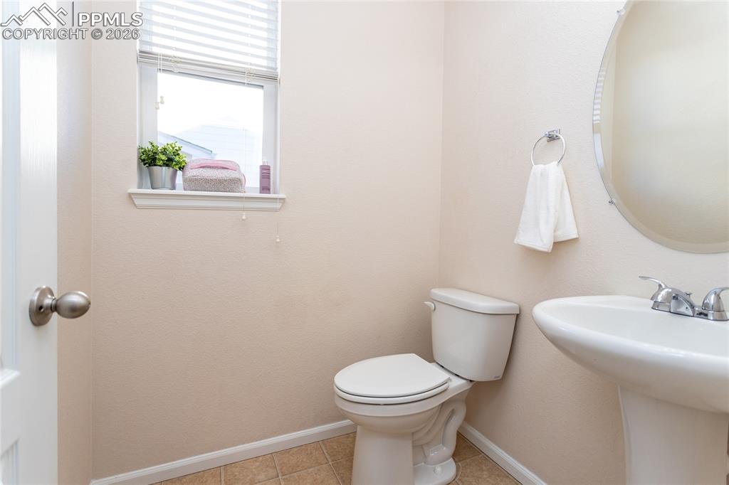 Image 16 of 39: Half bathroom on main level