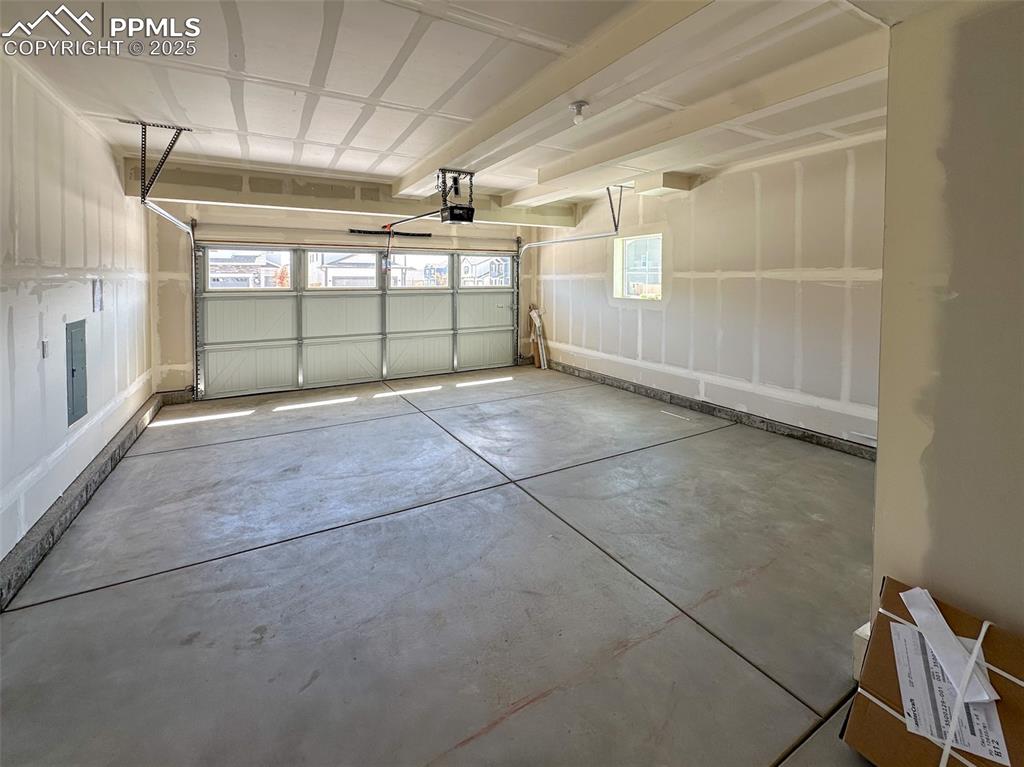 Image 15 of 35: Oversized, finished garage 