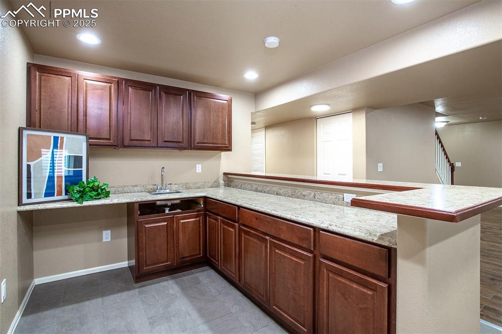 Image 16 of 46: Kitchen with a peninsula and recessed lighting