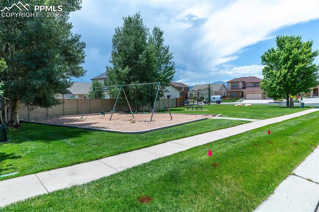 Image 37 of 46: Community jungle gym featuring a residential view