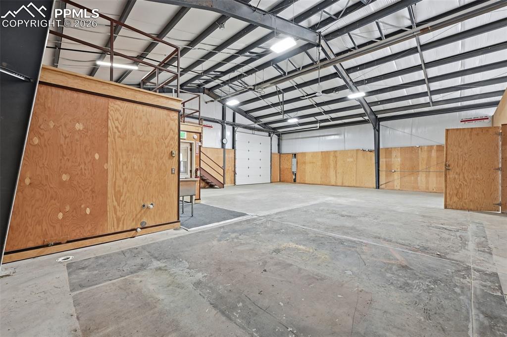 Image 10 of 34: Existing rack and storage areas help maximize usable floor space