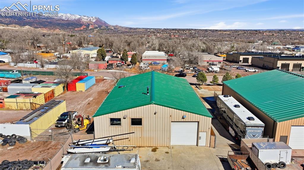 Image 23 of 34: Aerial: 0.37-acre site with front and rear access, parking, and operational