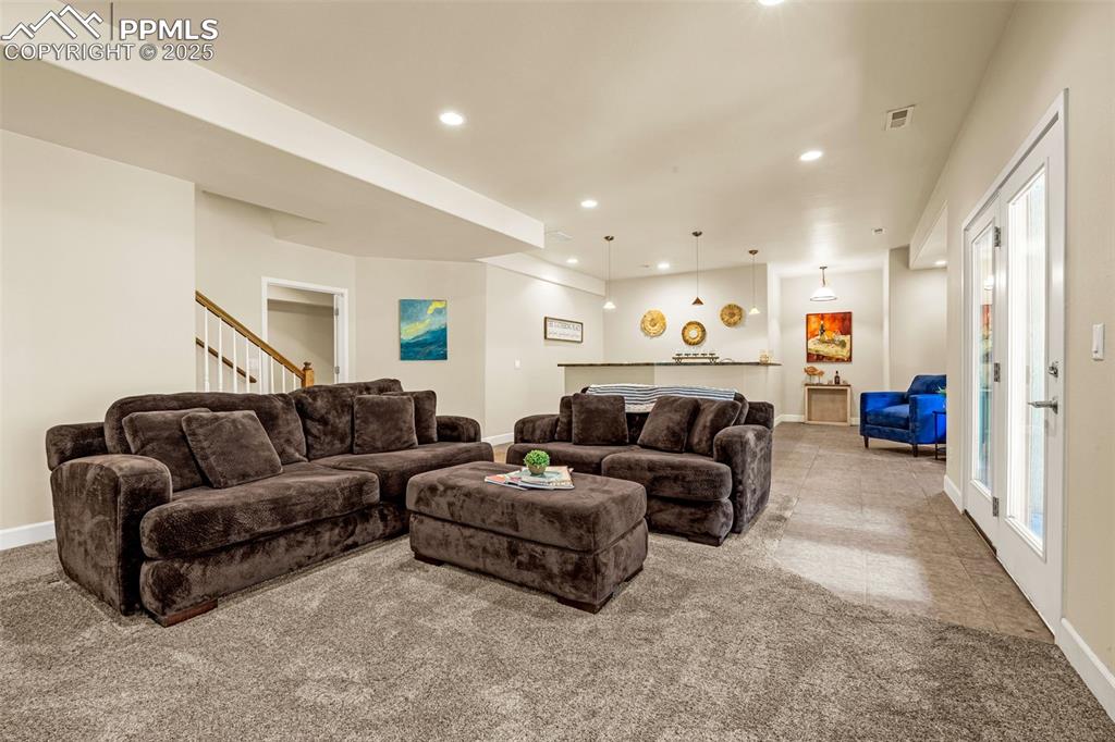 Image 20 of 41: Living room featuring baseboards, recessed lighting, carpet flooring, and s