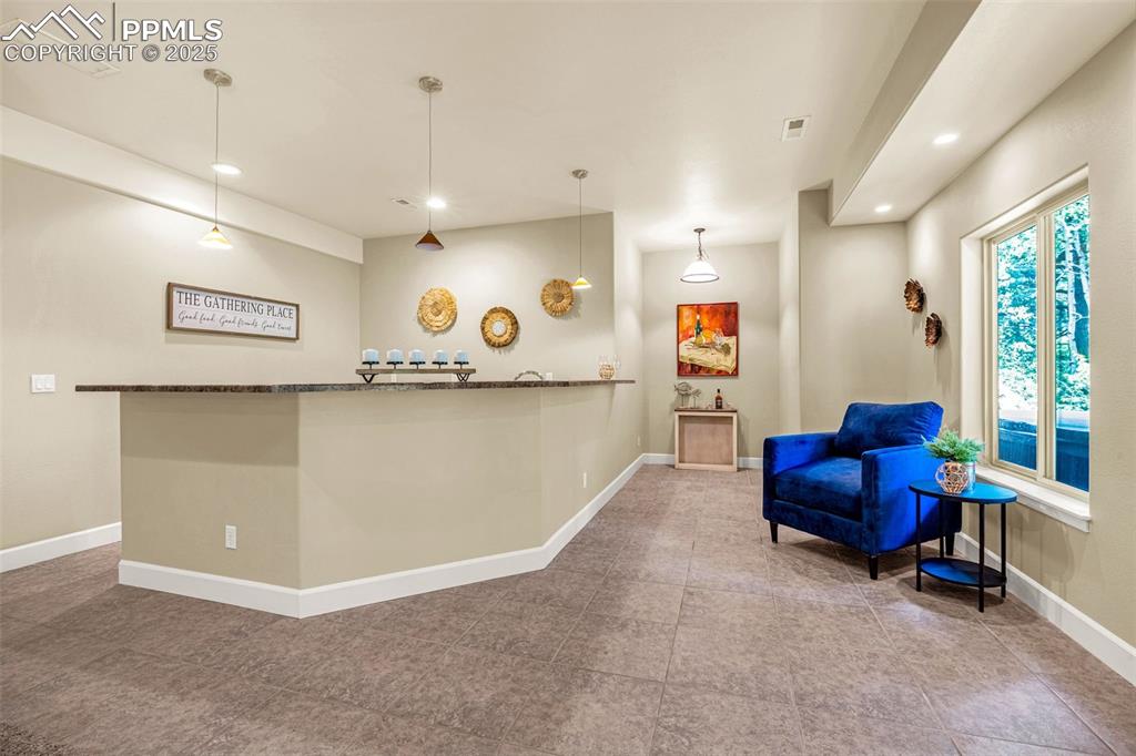 Image 21 of 41: Living area featuring recessed lighting and baseboards