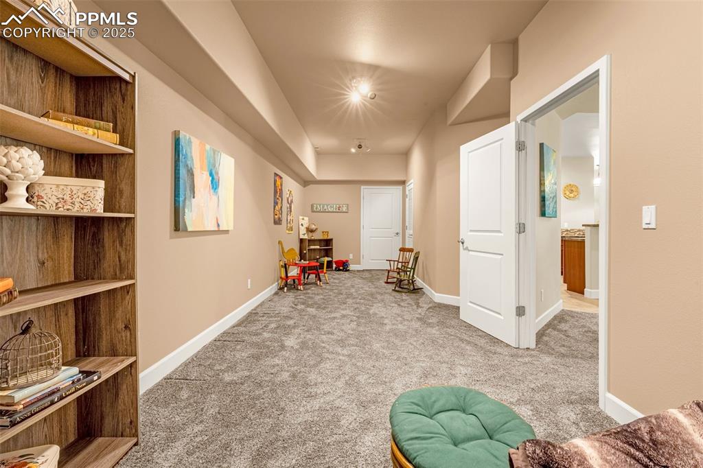 Image 23 of 41: Playroom featuring carpet and baseboards