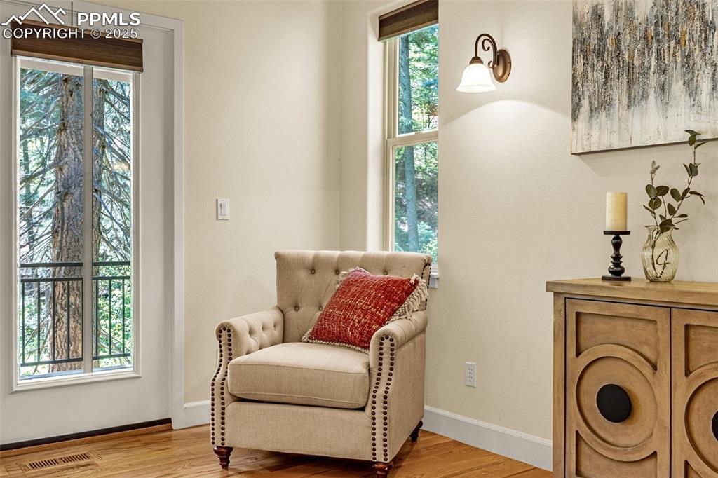 Image 28 of 41: Sitting room with light wood-style flooring and baseboards