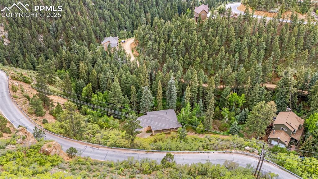 Image 36 of 41: Aerial view of a heavily wooded area