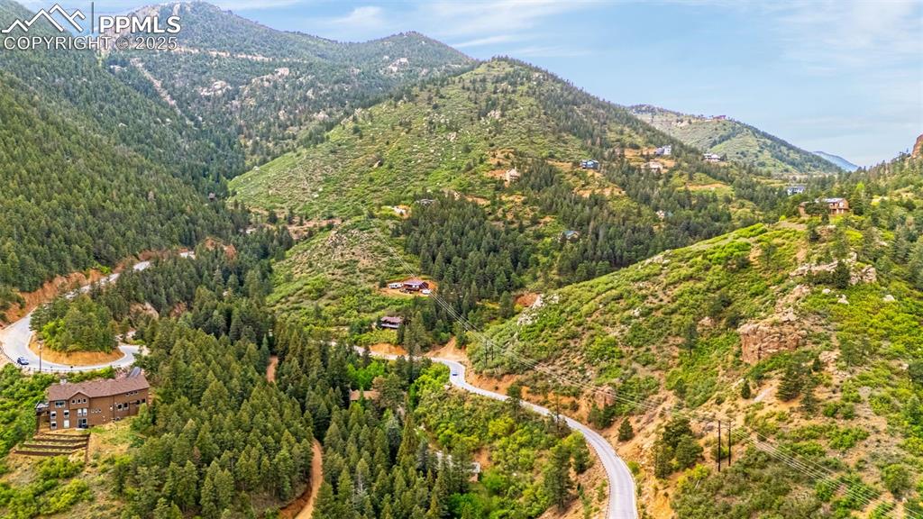 Image 38 of 41: Mountain view with a heavily wooded area