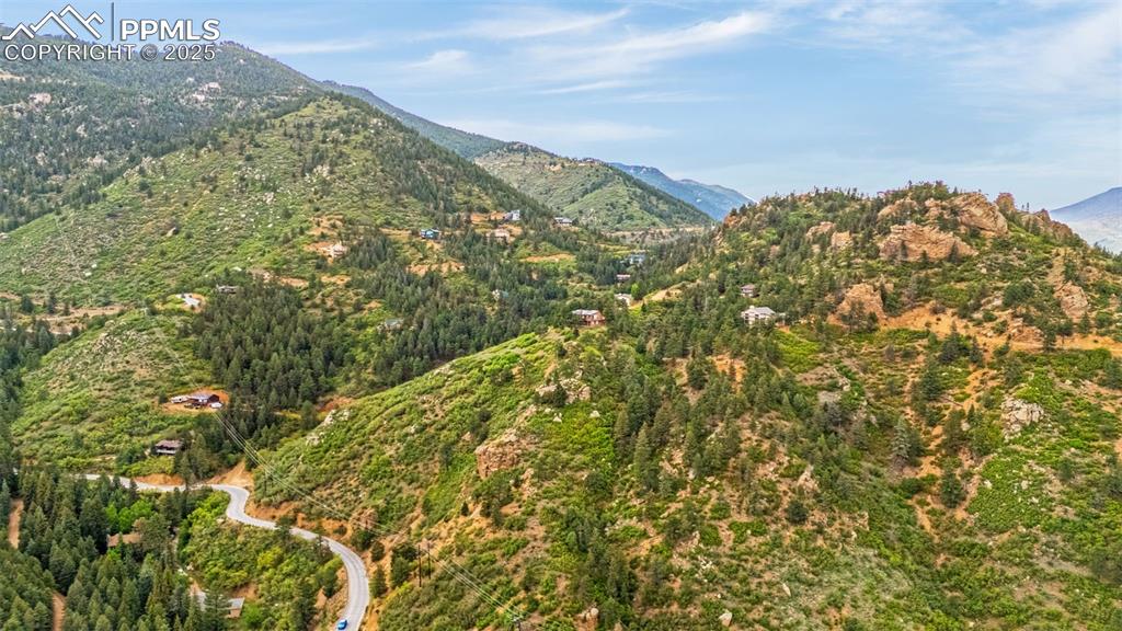 Image 39 of 41: Mountain view with a heavily wooded area