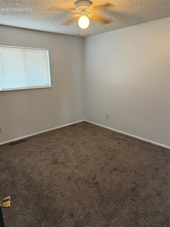 Image 6 of 16: Carpeted flooring, neutral wall tones, window with horizontal blinds, and a