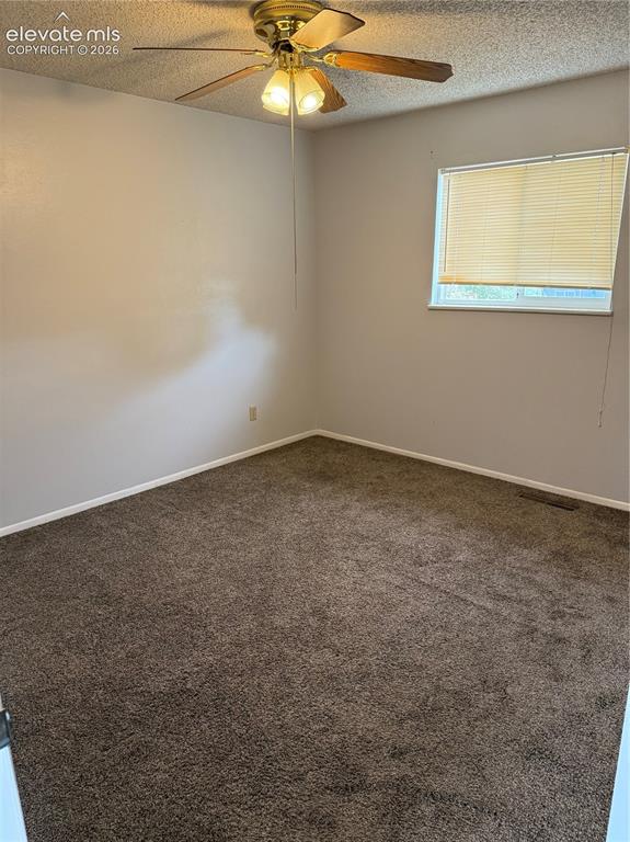 Image 7 of 16: Carpeted flooring, neutral wall tones, a ceiling fan with integrated lighti