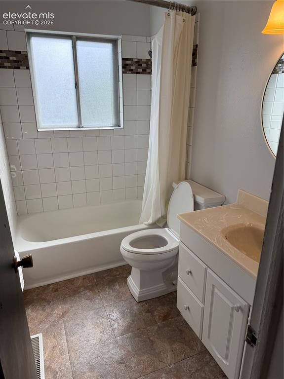 Image 8 of 16: Full bathroom featuring a ceramic tile surround, alcove bathtub with shower