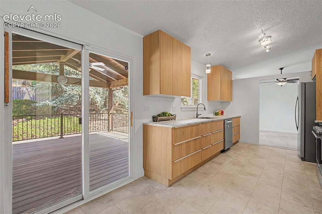 Image 11 of 46: Walkout to Huge 16 x 14 Covered Deck