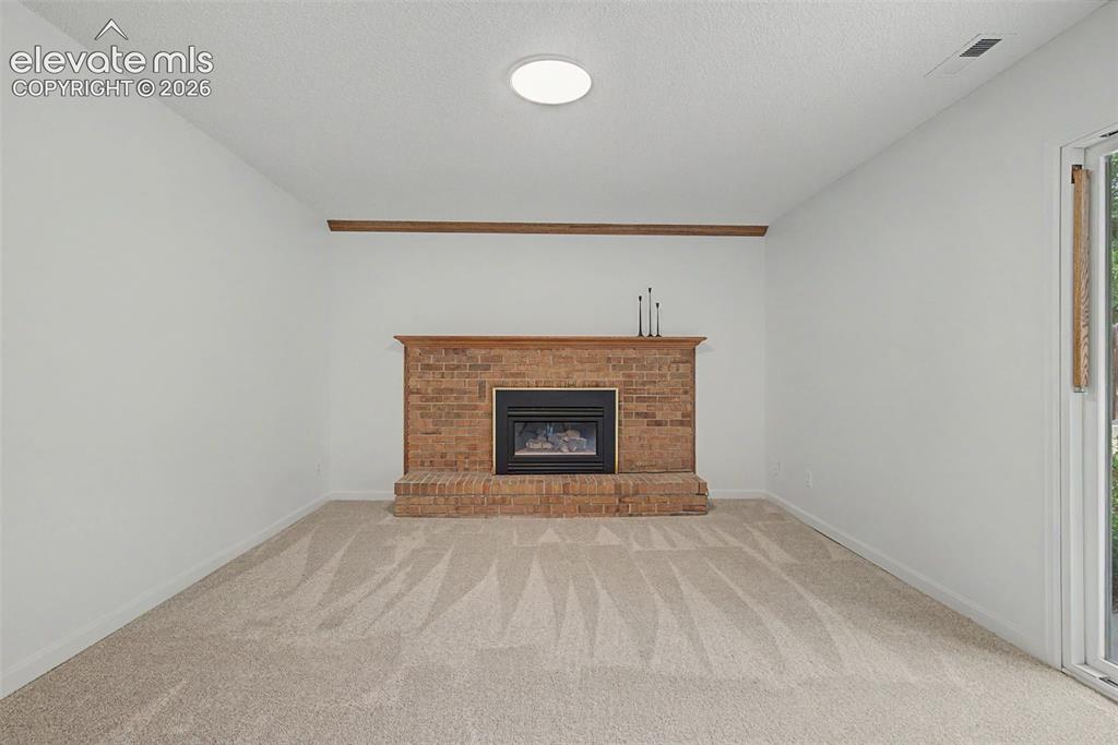 Image 14 of 46: Cozy Family Room with Gas Firepalce