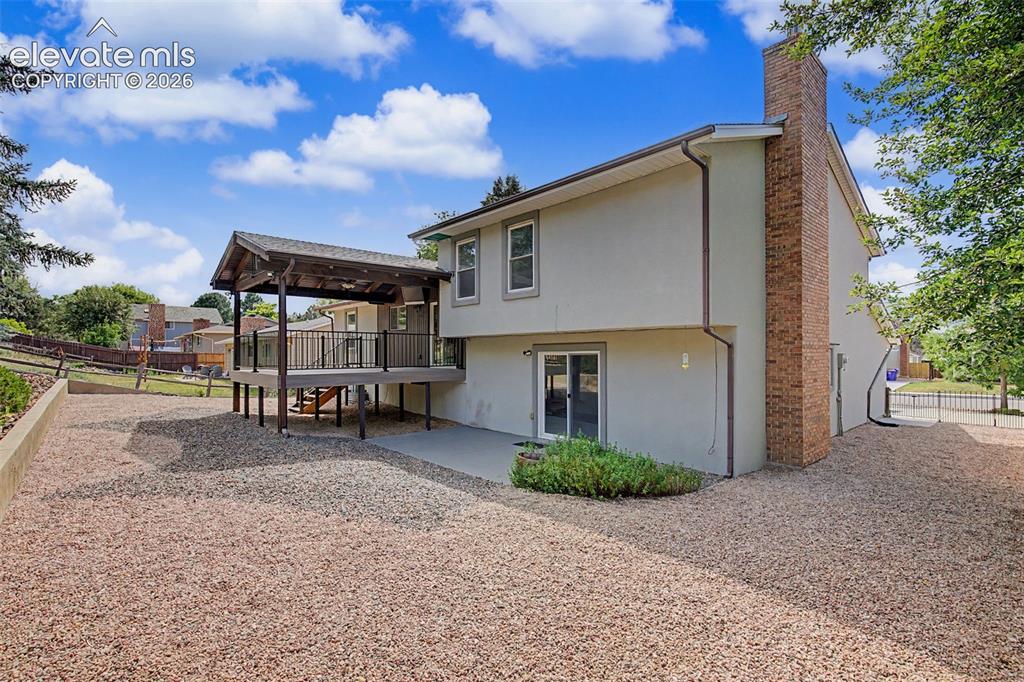 Image 46 of 46: Large Deck and Concrete Patio for Entertaining