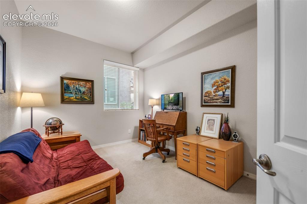 Image 13 of 32: Recessed ceiling detail, window with horizontal blinds, neutral wall tones,