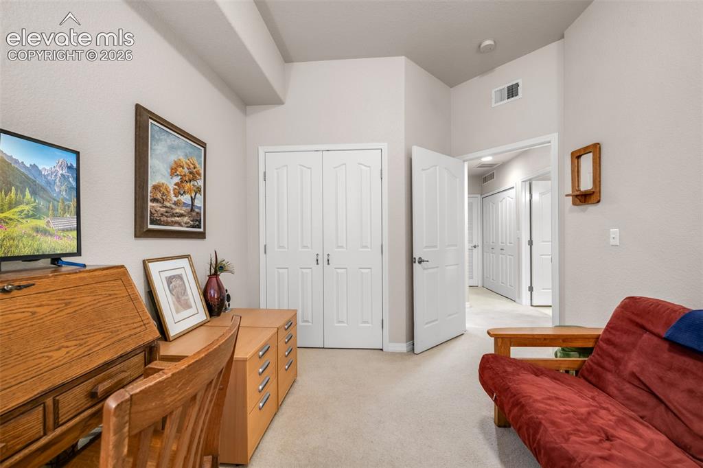 Image 14 of 32: Soft carpet flooring with neutral wall tones