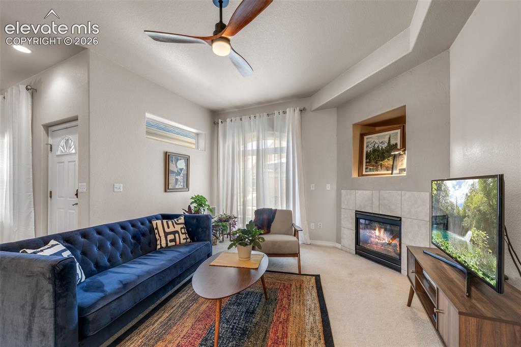 Image 2 of 32: Recessed lighting and a ceiling fan with integrated lighting