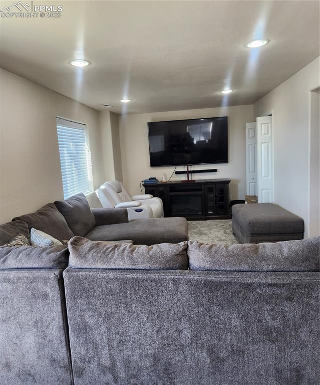 Image 24 of 45: basement rec area featuring recessed lighting