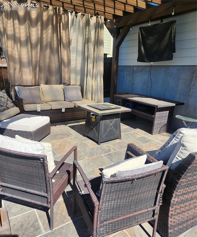 Image 26 of 45: View of patio / terrace with an outdoor hangout area