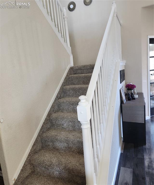 Image 31 of 45: Stairs featuring baseboards and carpet floors