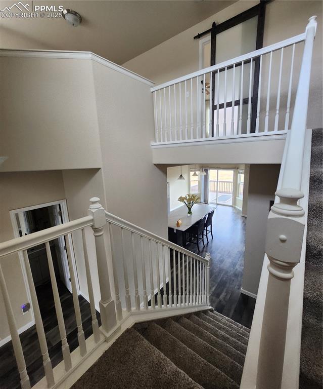 Image 44 of 45: Stairs with wood finished floors