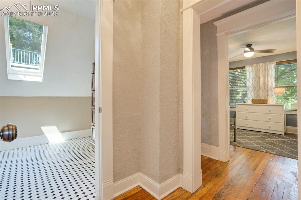 Image 26 of 37: Bathroom with hardwood / wood-style flooring and a ceiling fan
