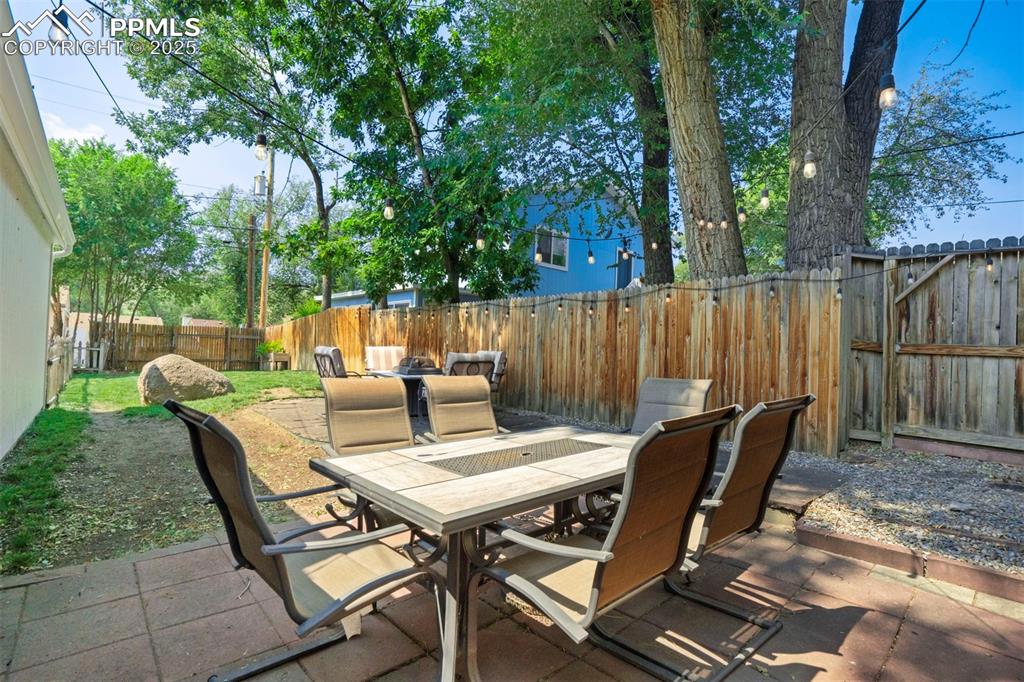 Image 29 of 37: Paver Patio in Fenced Backyard