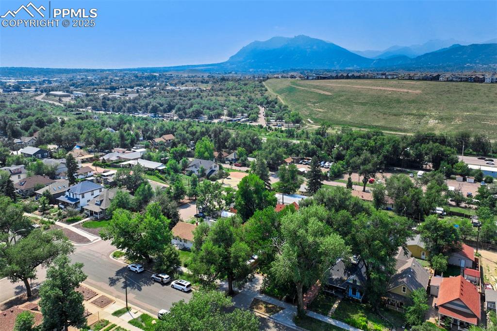 Image 32 of 37: Aerial view of residential area with mountains