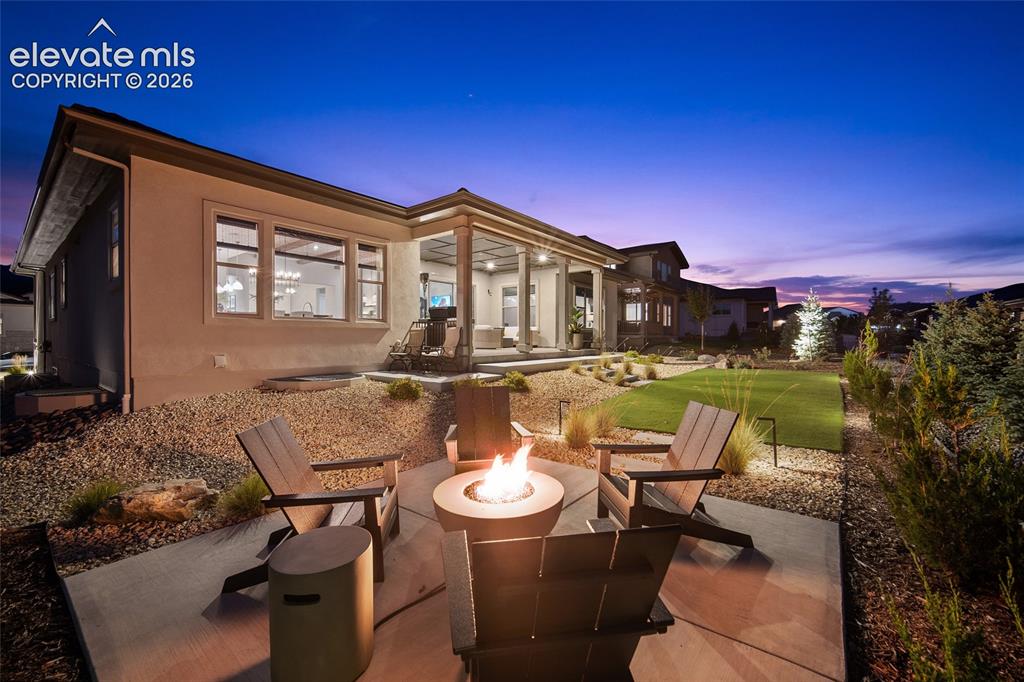 Image 7 of 45: Mountain views from inviting firepit area