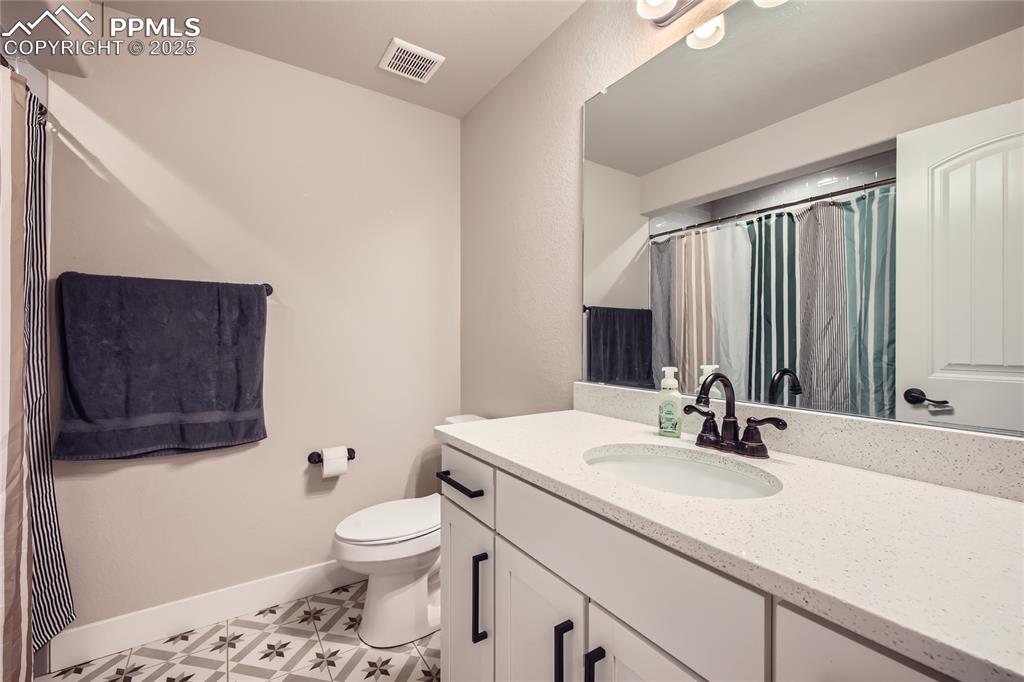 Image 24 of 37: Full bathroom featuring vanity and toilet
