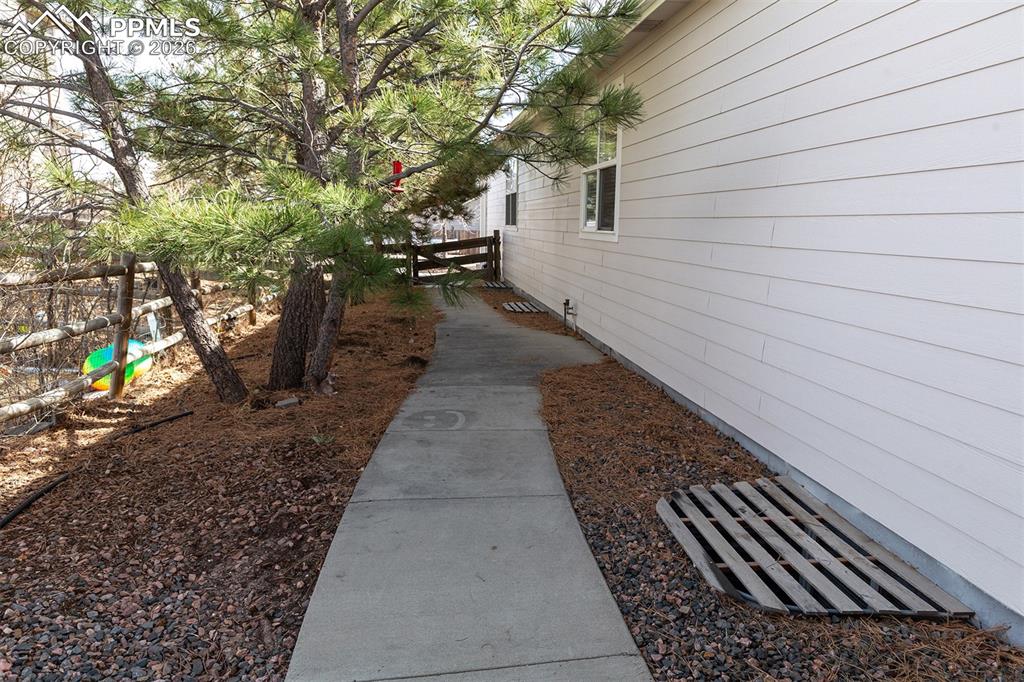 Image 26 of 34: Walkway to the front of home..