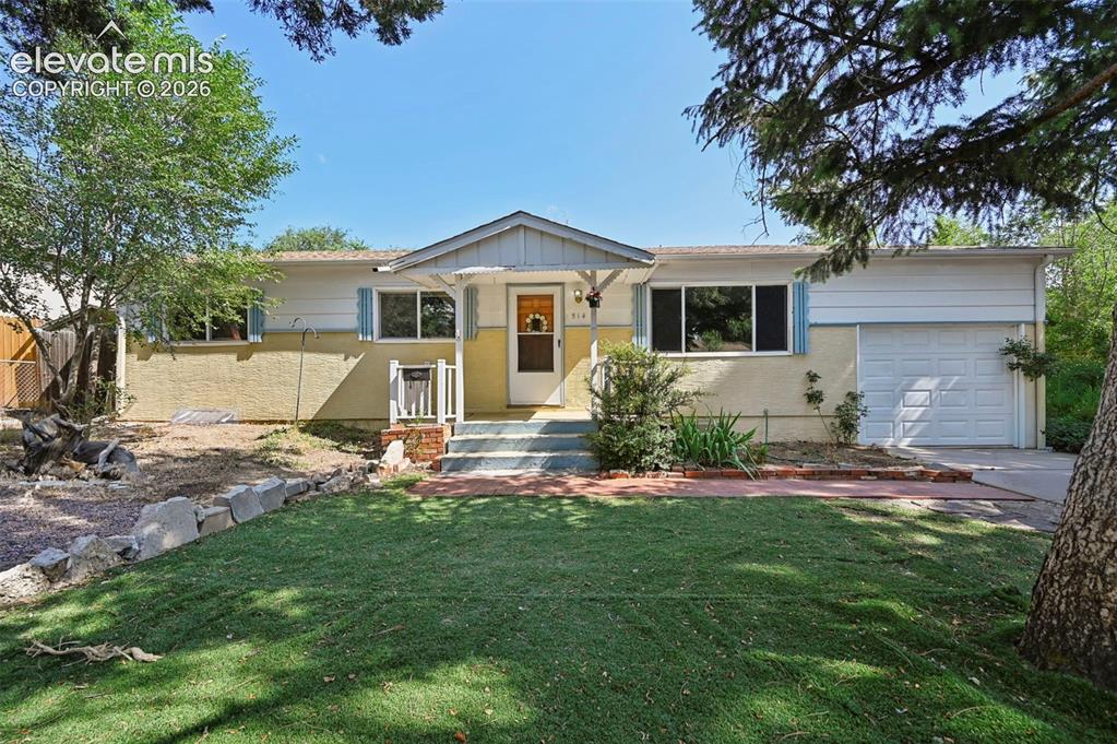 Image 2 of 32: Single-story residence featuring a covered front entry with white railings,