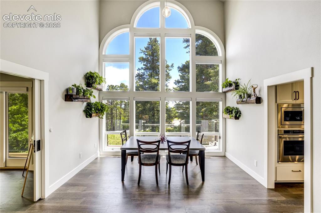 Image 11 of 50: Dramatic cathedral windows, soaring ceilings, and abundant natural light cr