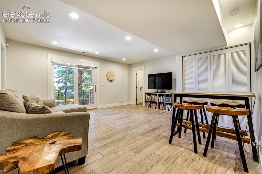 Image 35 of 50: Expansive gathering space ideal for movie nights, entertaining, or extended