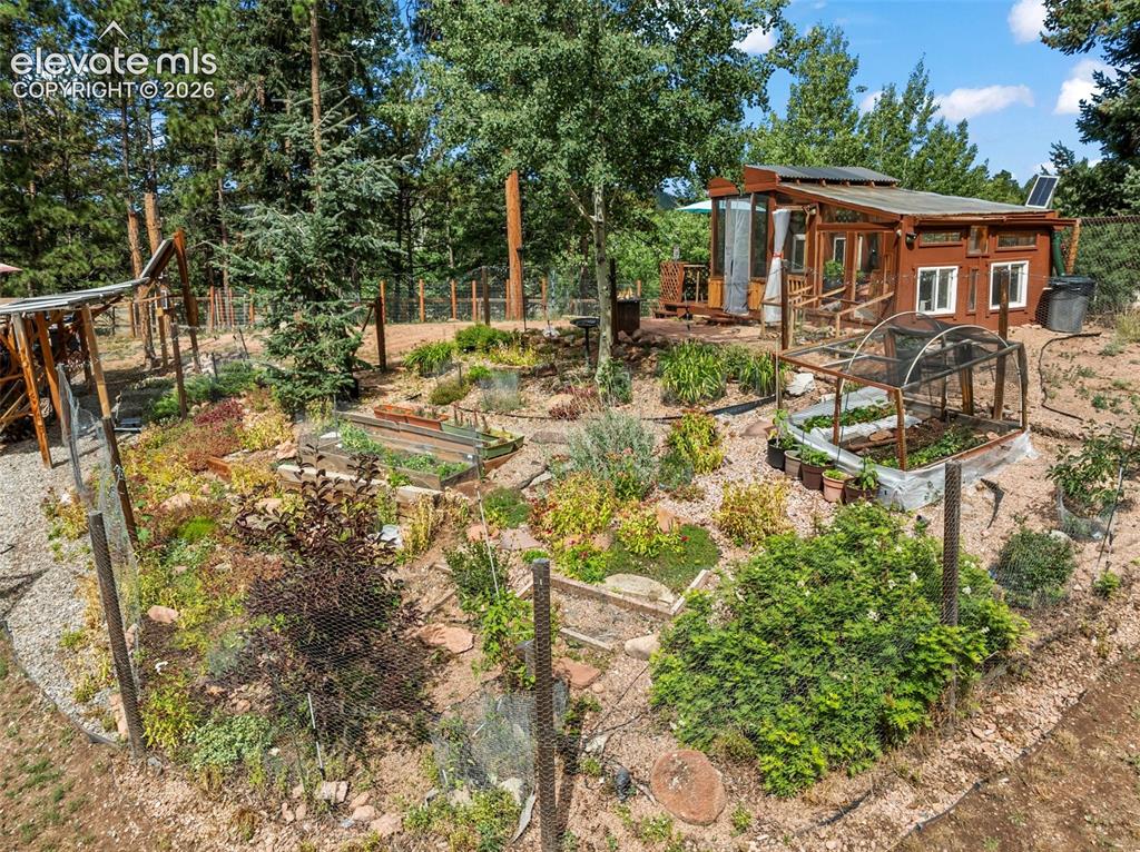 Image 6 of 31: Beautiful garden area! Safe from our friendly Woodland Park Deer!