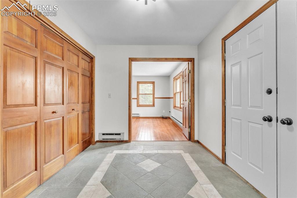 Image 7 of 43: Foyer featuring inlaid floor details