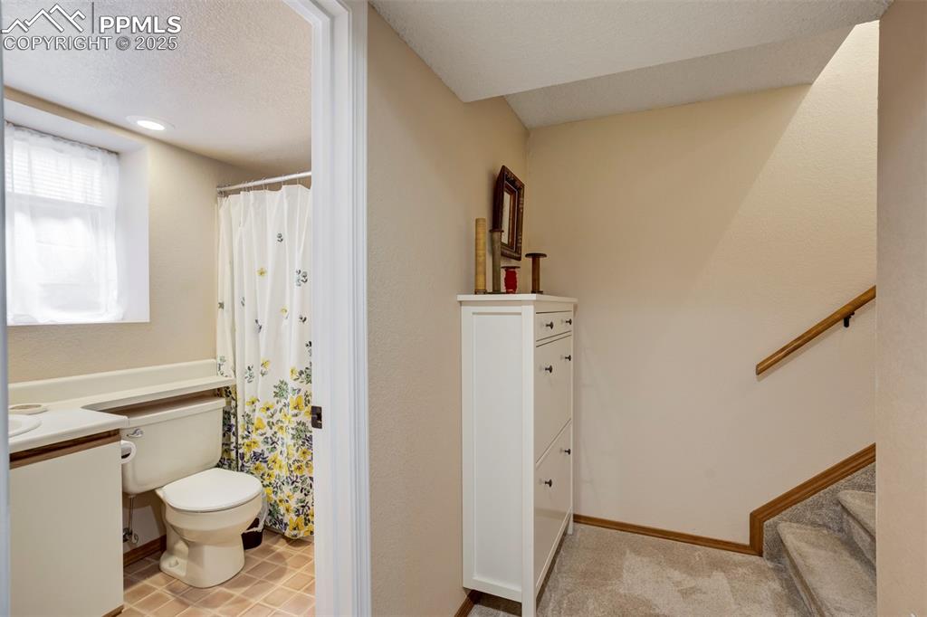 Image 25 of 48: Entry To Basement; Full Bathroom