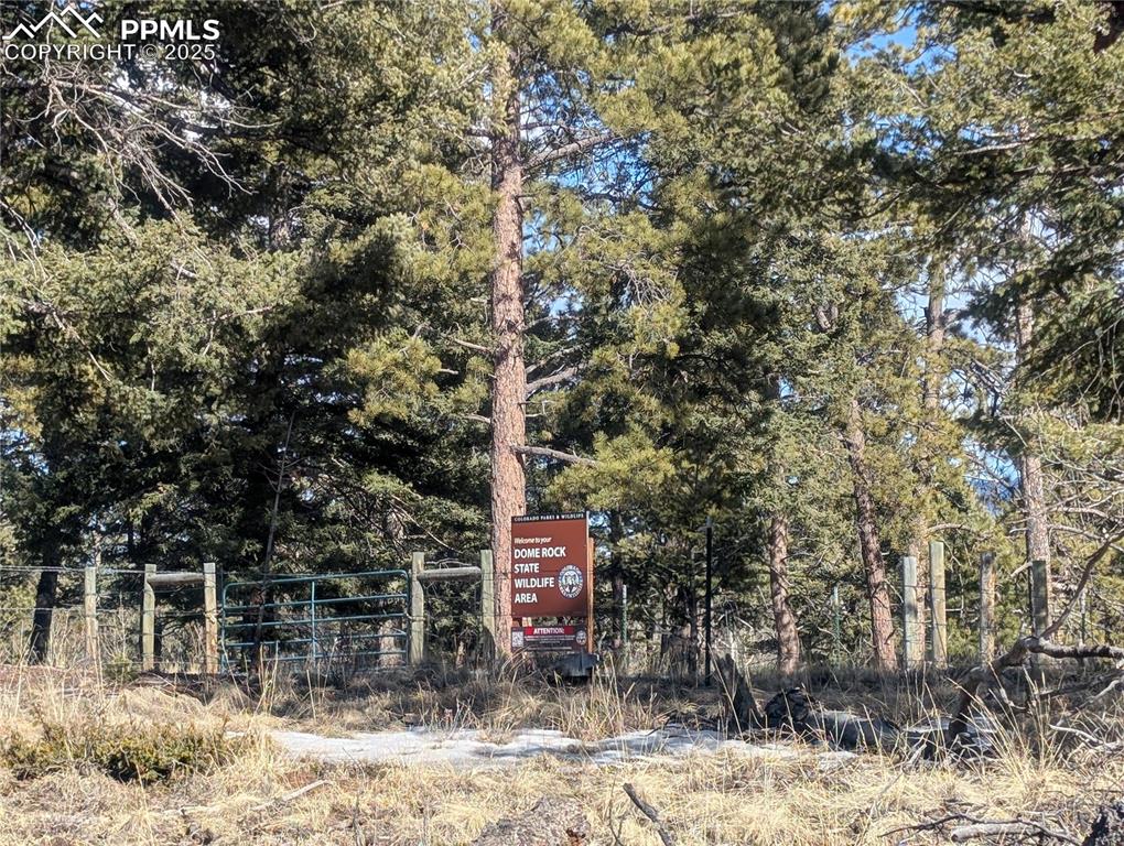 Image 3 of 28: Adjoining Dome Rock State Wildlife Area, trailhead entrance