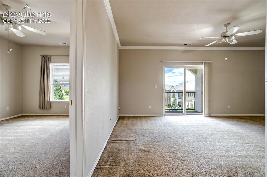 Image 21 of 50: Living room and primary bedroom