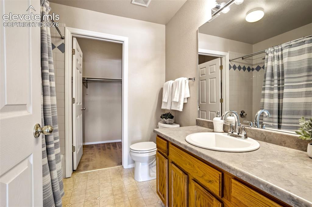 Image 27 of 50: Full bathroom with tub/shower. Access to the walk-in closet