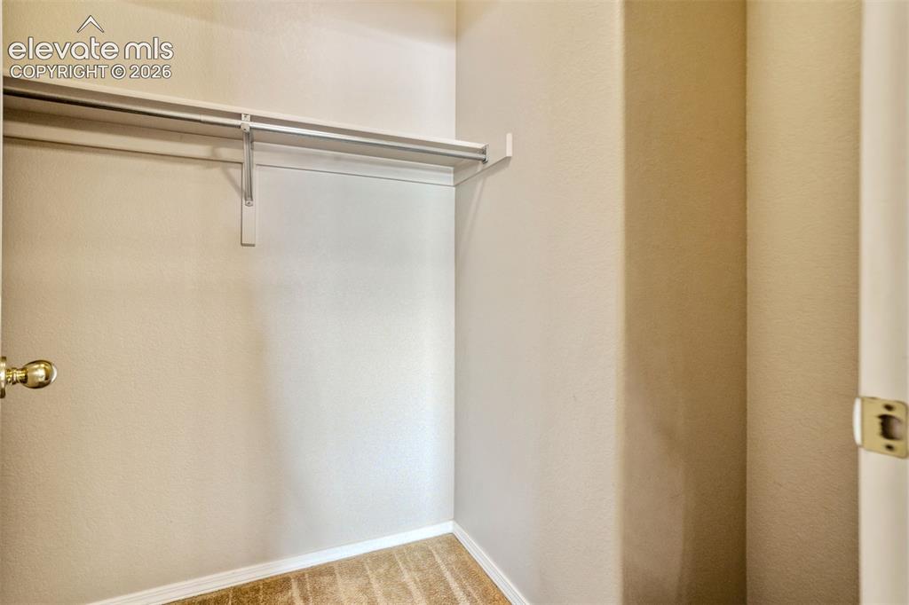 Image 29 of 50: Walk-in Closet attached to Primary Bathroom
