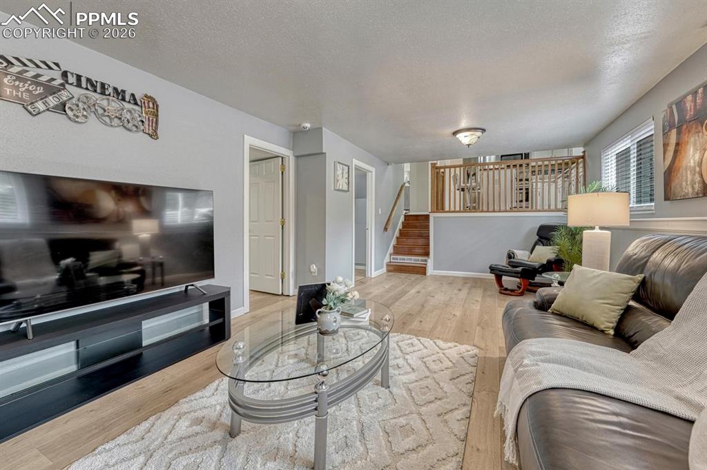 Image 16 of 42: Off the family room is a convenient laundry bathroom space and separate bed