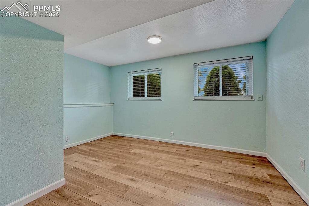 Image 17 of 42: This lower-level room is perfectly situated to be a private home office or 