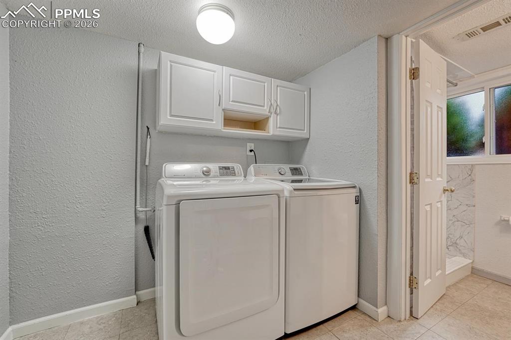 Image 19 of 42: Chores are easier in this dedicated lower-level laundry room
